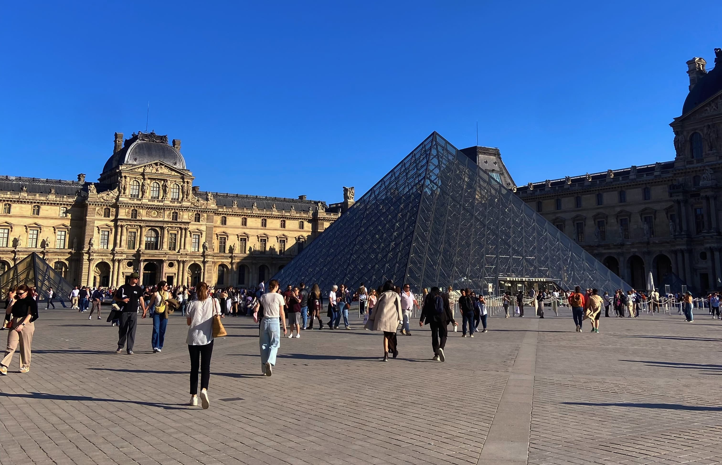Glass pyramid entrance in the courtyard of the Louvre Museum